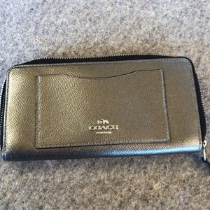Coach zip around wallet in silver, used but good condition.